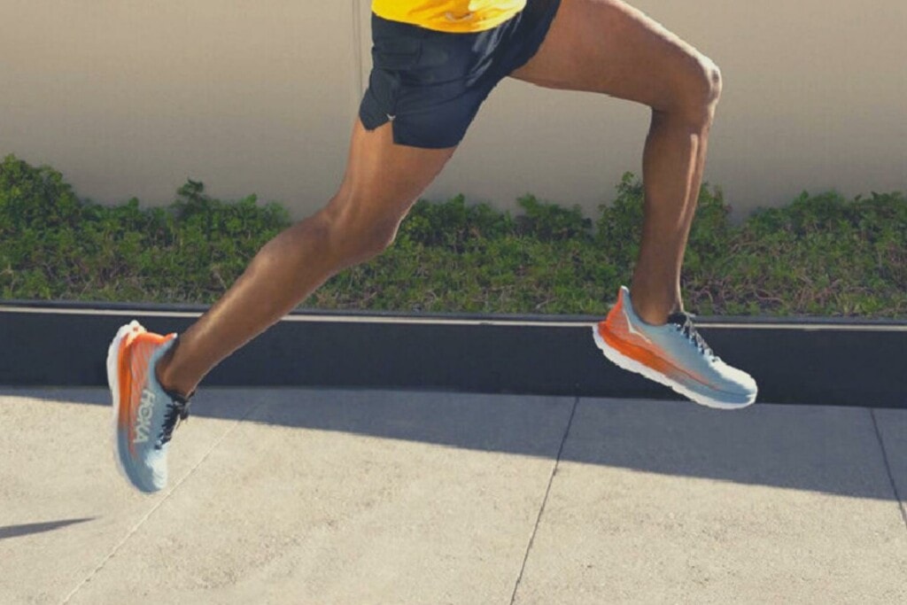 A male runner wearing Hoka Mach 5