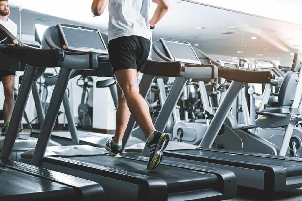 sportsman using treadmill in a gym at steady pace (same speed as outside)