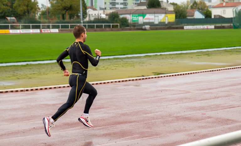 Runner on a track in marathon racing shoes