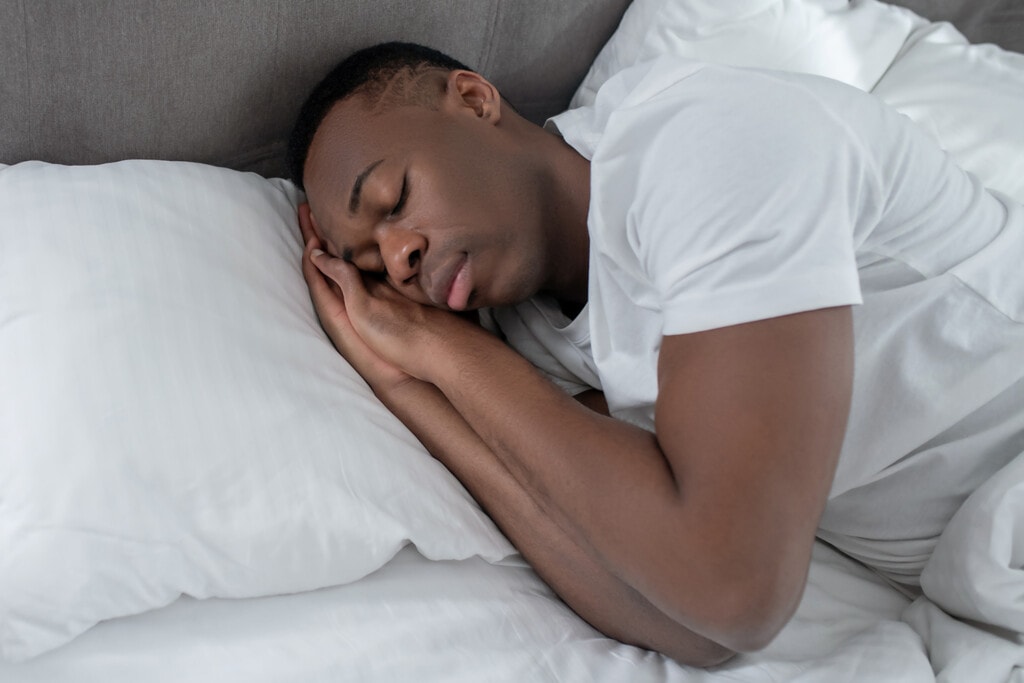 runner sleeping after strenuous activity to enhance athletic performance 
