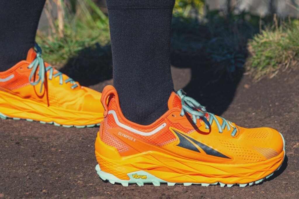 Altra Olympus 5 on feet, ideal for day hikes and long runs