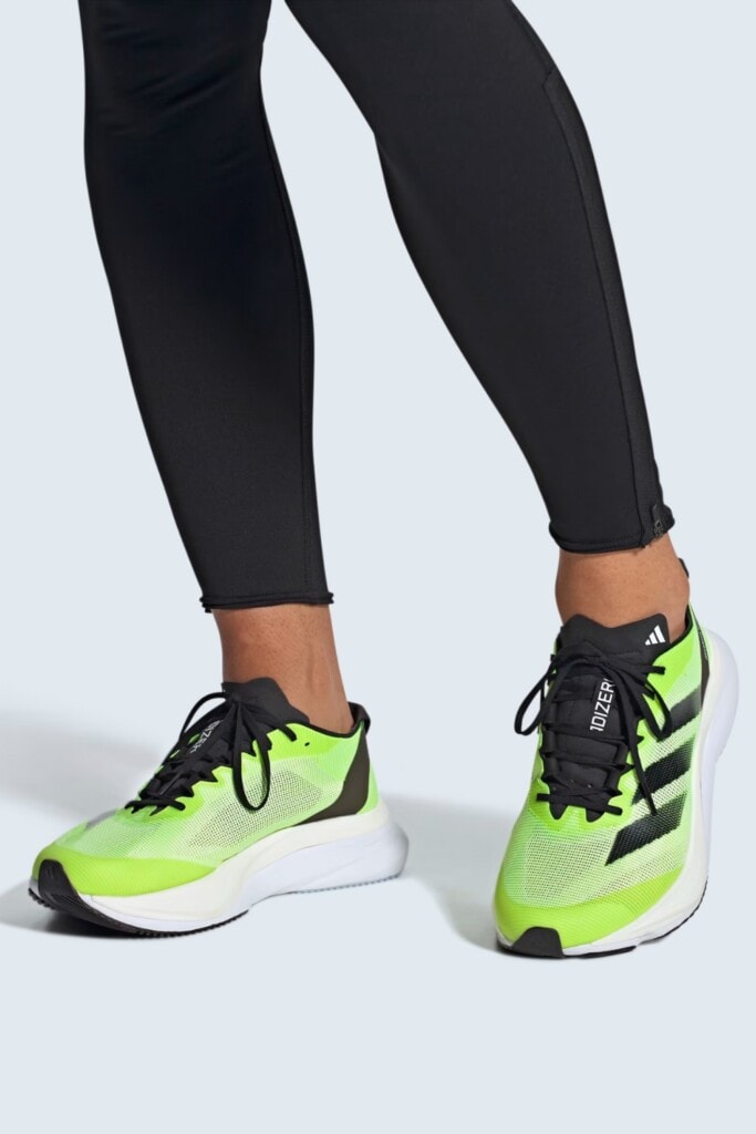 a runner wearing a men's version of the Adidas Adizero Boston 12