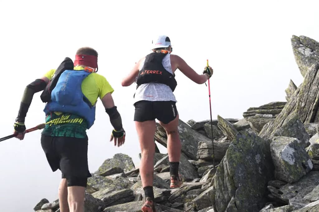 Ultra Trail Snowdonia by UTMB runners climbing a rocky terrain
