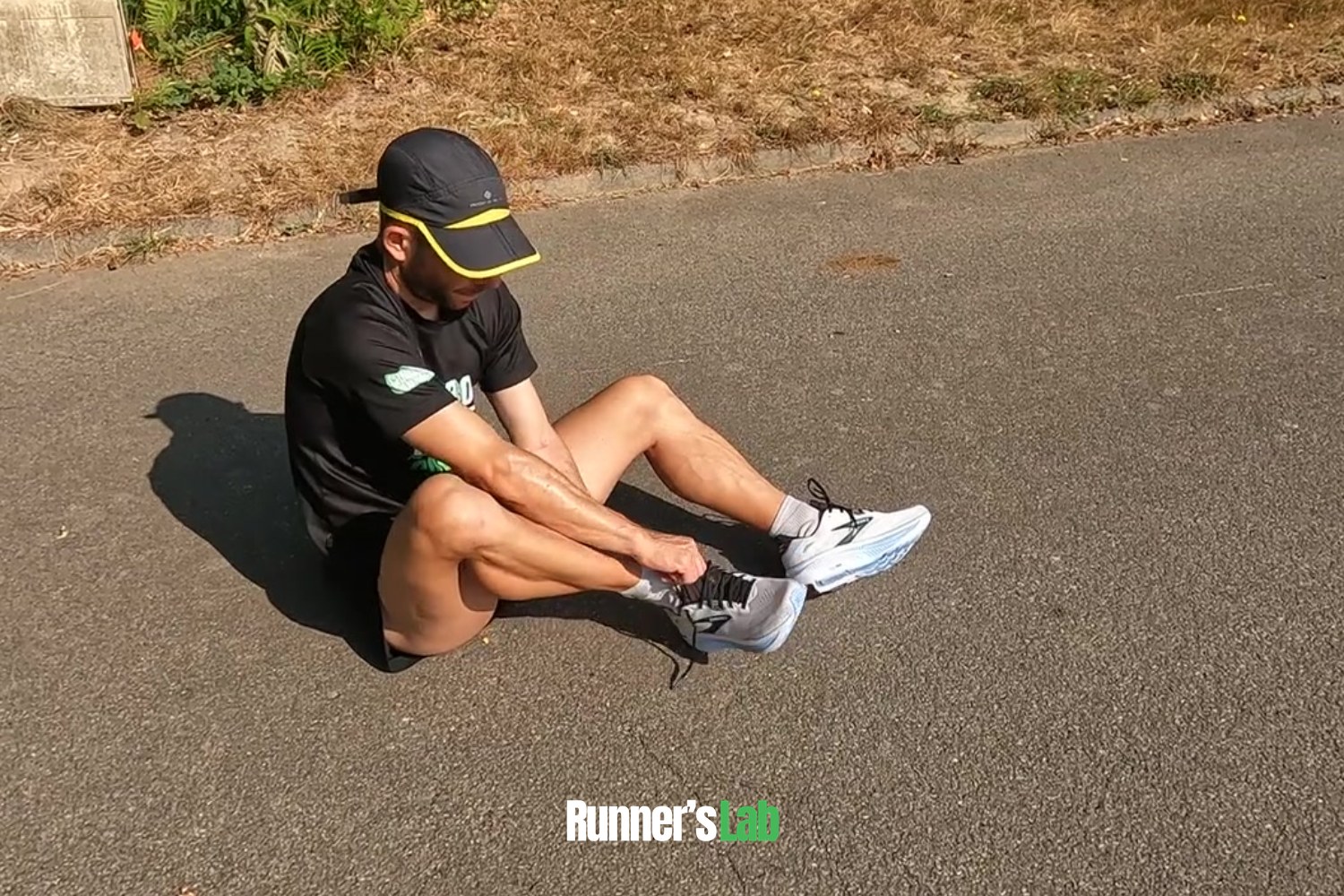 Runner lacing up the Brooks Ghost 18