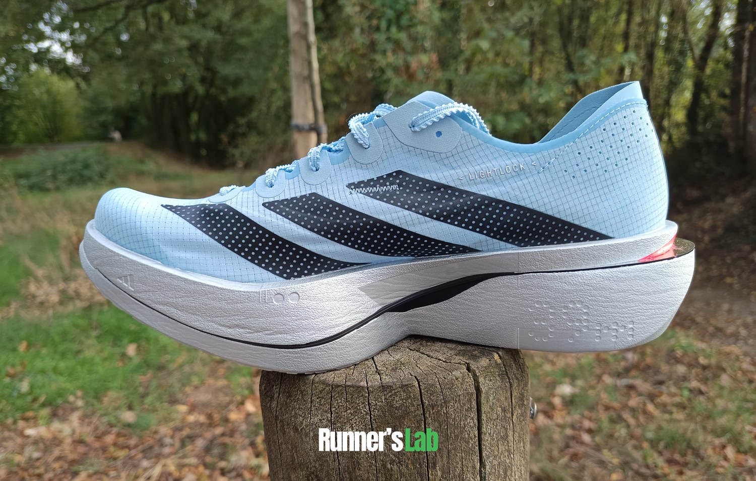 Adidas Adios Pro 5 side view with its three stripes