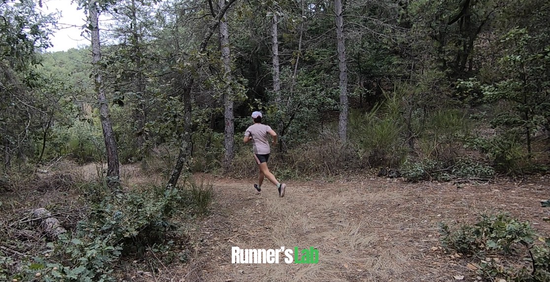 Alecsa running in the woods in the Asics Blazeblast